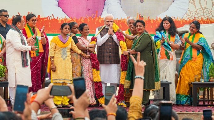 PM Narendra Modi being felicitated during the 'Nari Shakti Vandan-Abhinandan Karyakram', a day after Parliament passed the women's reservation bill, at the BJP headquarters in New Delhi | PTI photo