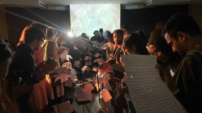 Attendees reading the letters curated by Project-39A | Antara Baruah | ThePrint