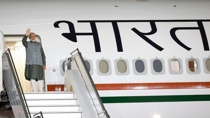 Modi on the Air India One ahead of his trip to Jakarta. | ANI