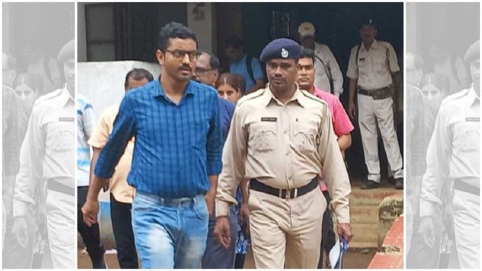 ABP journalist Debmalya Bagchi (L) with the police | Photo courtesy: Twitter, @SuvenduWB