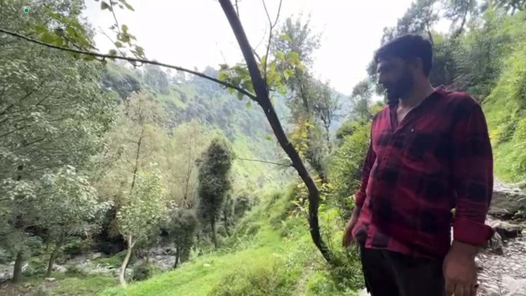 Rafik outside his house