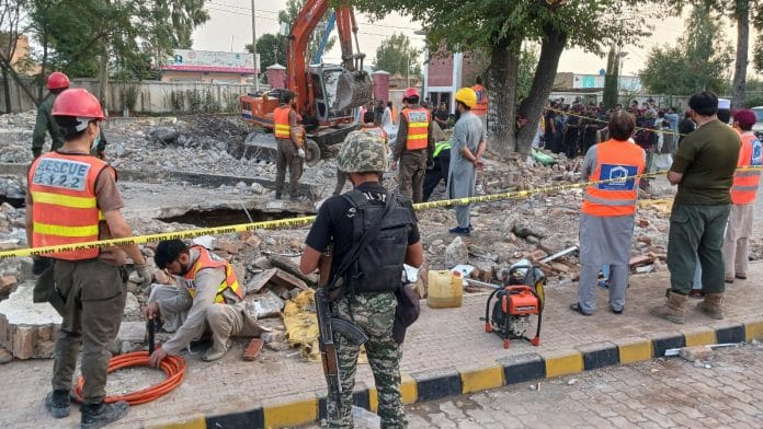 Rescue workers clear the rubble from a damaged mosque, after a suicide blast in Hangu, Pakistan | Reuters