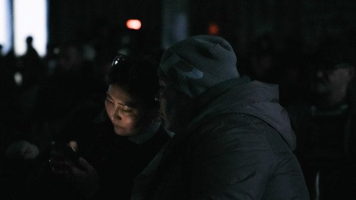 Relatives of miners gather at the Kostenko coal mine operated by ArcelorMittal Temirtau during a power outrage, as a rescue operation continues following a mine fire, in Karaganda, Kazakhstan | Reuters