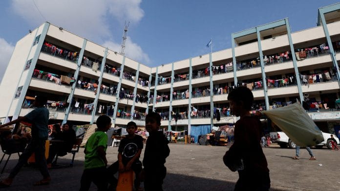 Palestinians, who have fled their homes due to Israeli strikes, take shelter in a UN-run school, in Khan Younis in the southern Gaza Strip | Reuters