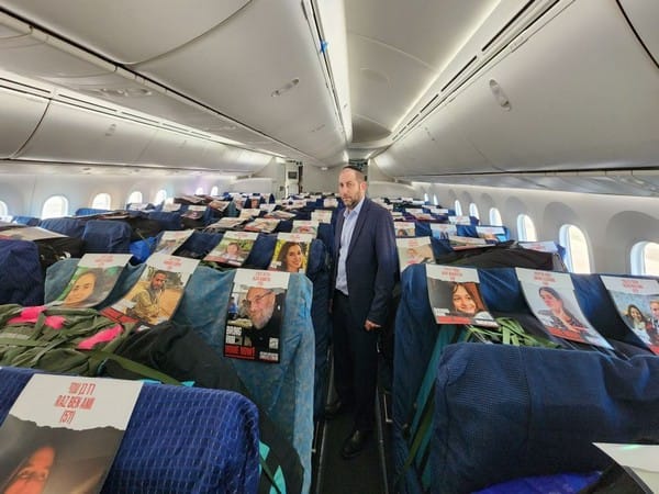EL AL puts photos of captive Israelis on seats of humanitarian delivery flight