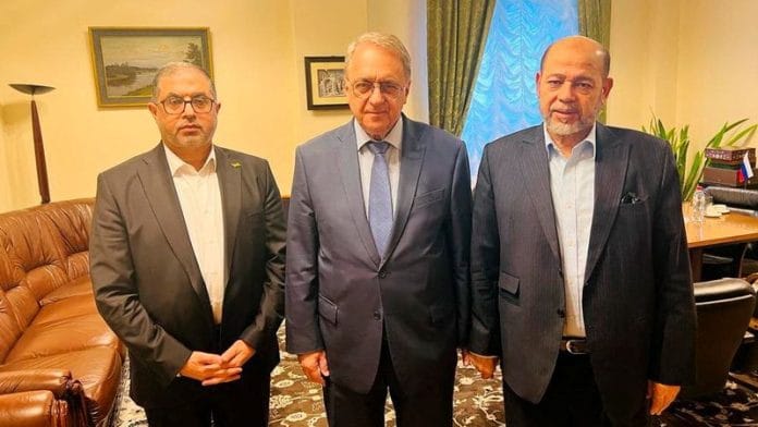 Senior Hamas officials Bassem Naim and Moussa Abu Marzouk, and Russia's Deputy Foreign Minister Mikhail Bogdanov meet for talks on the release of foreign hostages in Moscow | Hamas Handout/Handout via Reuters