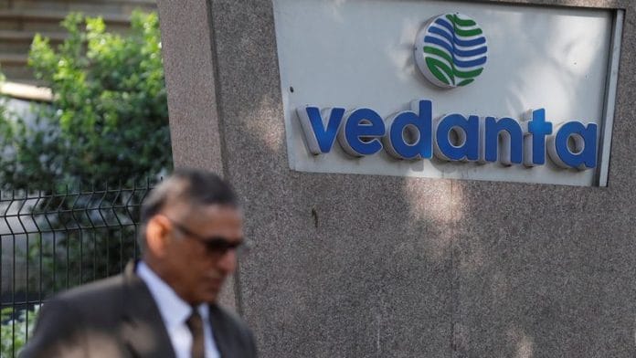 A man walks past the logo of Vedanta outside its headquarters in Mumbai | Reuters file photo