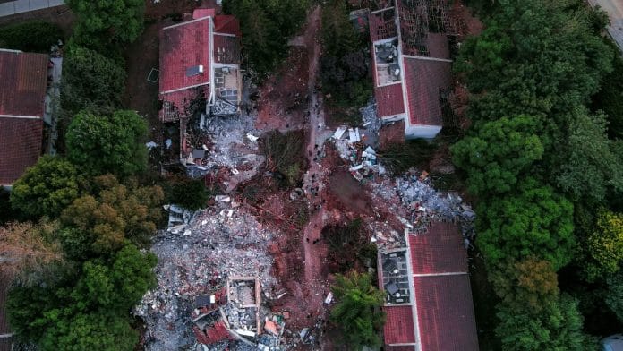 An aerial view shows damage caused following a mass infiltration by Hamas gunmen in Kibbutz Beeri in southern Israel, 11 October, 2023. REUTERS/ Ilan Rosenberg
