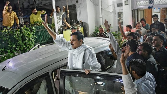 AAP MP Sanjay Singh waves after he was arrested by the ED in New Delhi on Wednesday | ANI Photo/Ishant