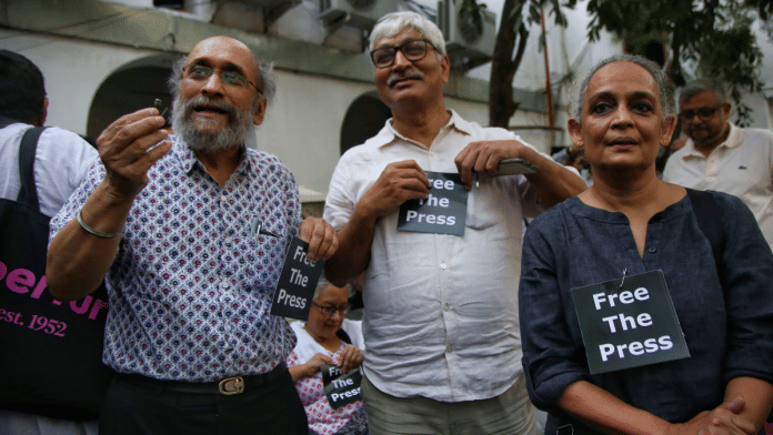 File photo of writer Arundhati Roy with senior journalist Paranjoy Guha Thakurta and political commentator Apoorvanand | Manisha Mondal | ThePrint