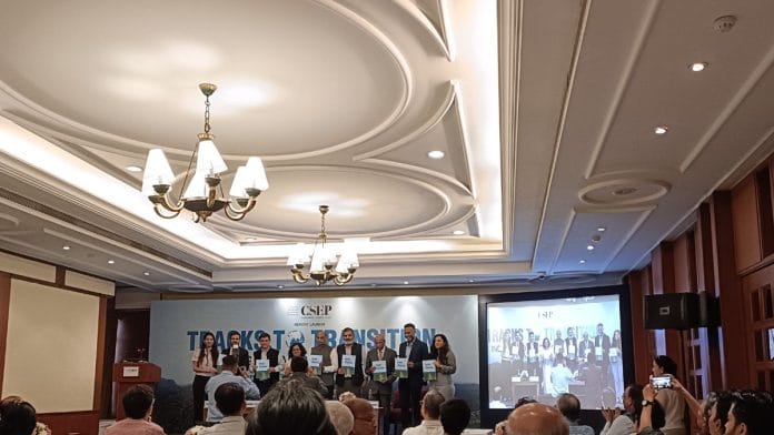 Panellists pose with the Centre for Social and Economic Progress' report, 'Tracks to Transition: India’s Global Climate Strategy', at Delhi's India Habitat Centre | Photo: Akanksha Mishra