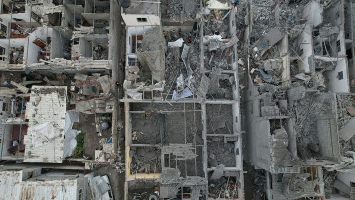 A view of the remains of a mosque and houses destroyed by Israeli strikes in the central Gaza Strip October 29, 2023. REUTERS/Mohammed Fayq Abu Mostafa