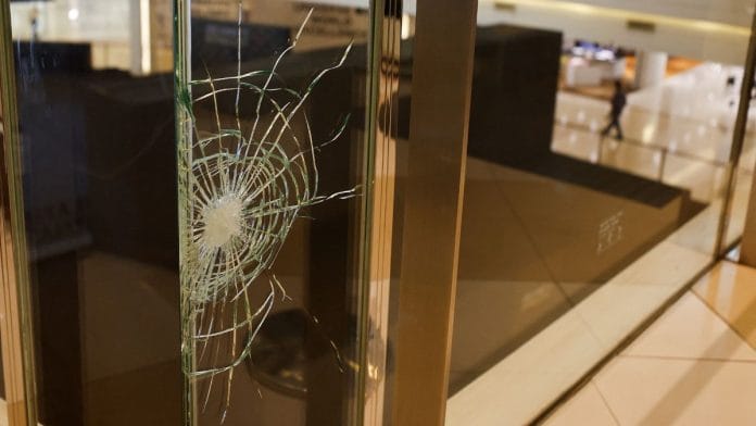 A bullet mark is seen on a glass at the luxury Siam Paragon shopping mall after Thai police arrested a teenage gunman who is suspected of killing foreigners and wounding other people in a shooting, in Bangkok, Thailand | Reuters/Jorge Silva