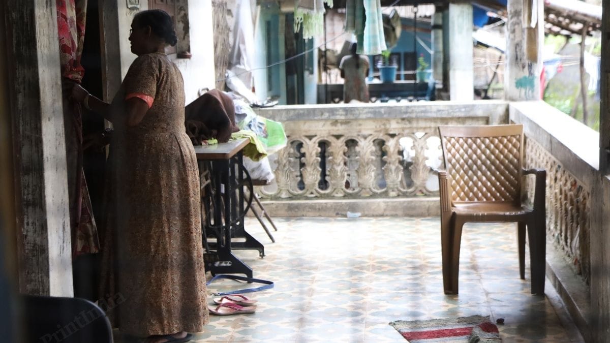 A woman in the rural Parsi village looks inside a house. Many of these homes were constructed by the WZO | Manish Mondal | ThePrint 