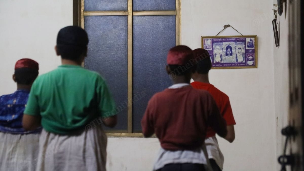 Parsi boys from Navsari pray at the fire temple at the Dosibai Kotwal Parsi Orphanage. It functionied as a Parsi boys' hostel due to the absence of orphans. All these boys live and study here either for free or at reduced rates. | Manish Mondal | ThePrint 