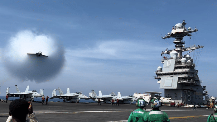 US navy personnel onboard USS Gerald R. Ford watches a fighter aircraft break sound barrier | Pic credit: X/@Warship_78