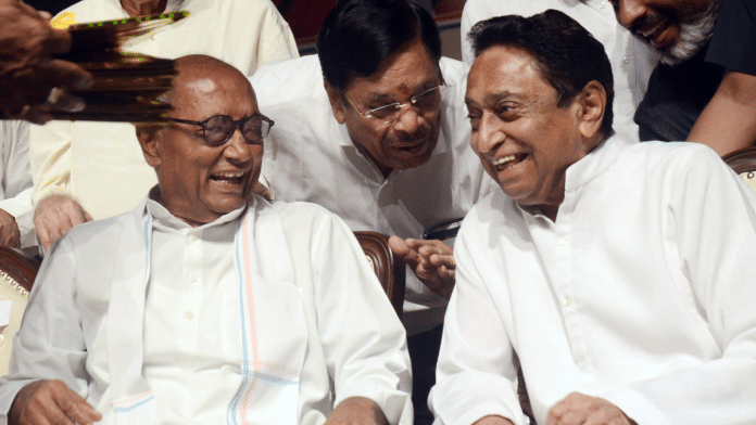 Congress Rajya Sabha MP Digvijaya Singh with PCC chief Kamal Nath during the release of party's manifesto in Bhopal | ANI