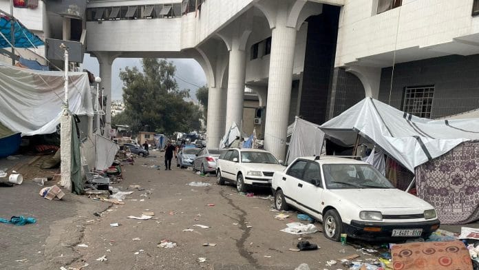 A man walks within the premises of Al Shifa hospital during the Israeli ground operation around the hospital, in Gaza City on 12 November, 2023 | Ahmed El Mokhallalati/via REUTERS/File Photo