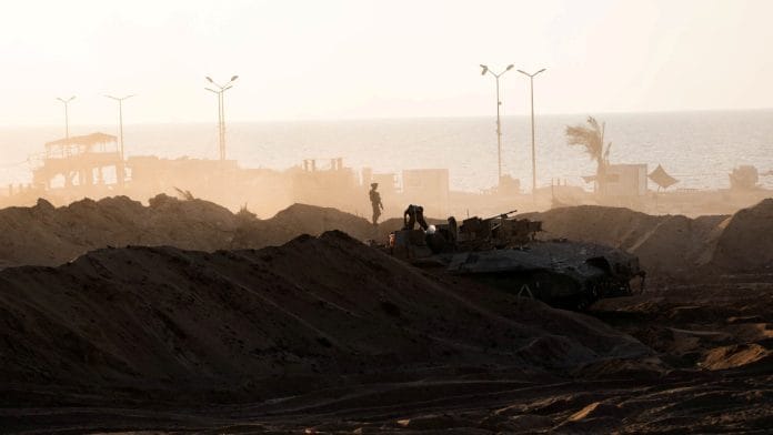 Israeli soldiers operate in the Gaza Strip, amid the ongoing ground operation of the Israeli army against the Palestinian Islamist group Hamas, in this handout picture released on November 18, 2023. Israel Defense Forces/Handout via REUTERS/File Photo