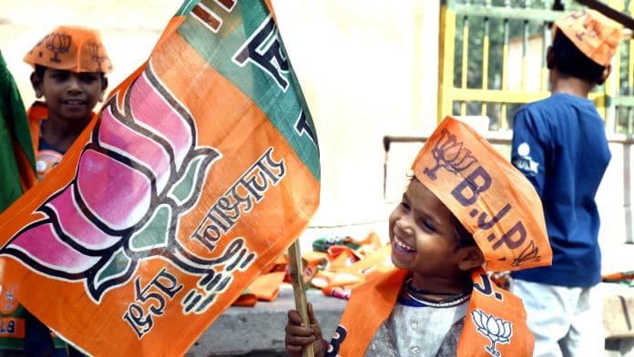 A wee Bharatiya Janata Party (BJP) supporter seen as Siddhi Kumari (unseen) arrives to file her nomination papers for the upcoming Rajasthan Assembly Elections, in Bikaner on Friday | ANI