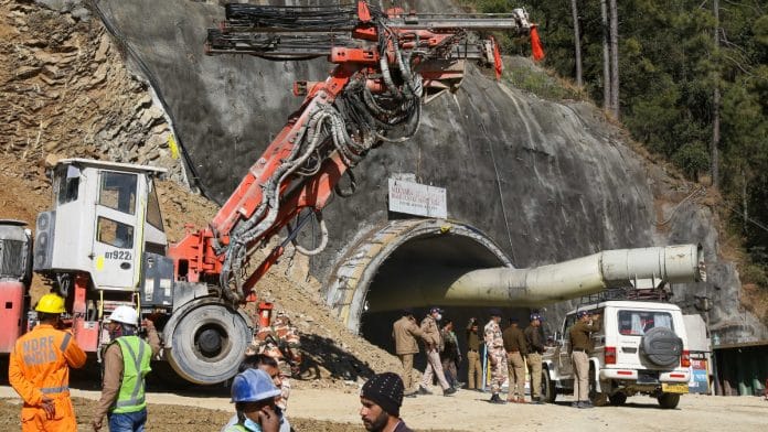 Workers make road for the vertical drilling on top of the mountain face below which an under construction tunnel has collapsed in the district of Uttarkashi | ThePrint photo by Suraj Singh Bisht