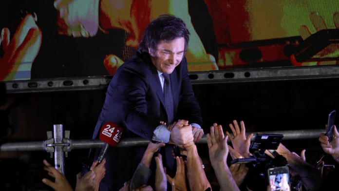 Argentine president-elect Javier Milei greets supporters after winning Argentina's runoff presidential election, in Buenos Aires, Argentina November 19, 2023 | Reuters