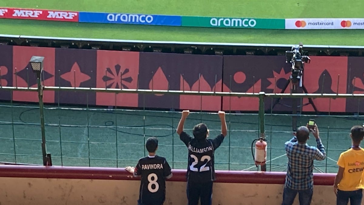 Two boys watching the match at Bengaluru’s Chinnaswamy Stadium on 9 November | By special arrangement