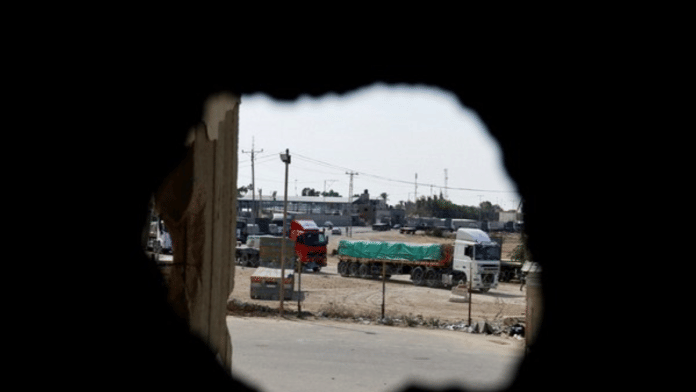 Trucks carrying aid arrive in Gaza (Photo Credit: Reuters)