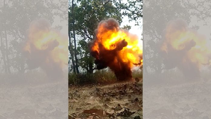 An IED pressure bomb is being defused by CRPF personnel after finding it during road construction, in Sukma on Tuesday | ANI
