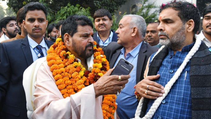 BJP MP Brij Bhushan Sharan Singh with newly-elected WFI president Sanjay Kumar Singh at his residence in New Delhi, Thursday | ANI/Ishant