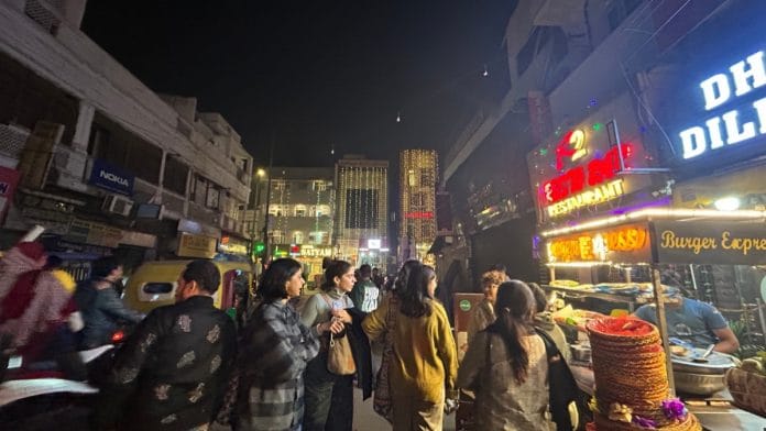Women Walk at Midnight group amid the brightly lit Paharganj streets | Zenaira Baksh/ThePrint