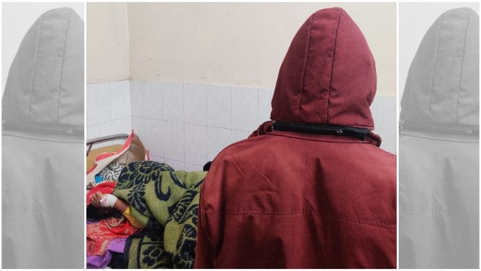 The girl's father stands beside her hospital bed | Bismee Taskin | ThePrint