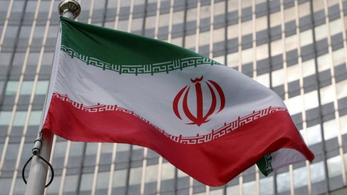 The Iranian flag flutters in front of the International Atomic Energy Agency (IAEA) organisation's headquarters in Vienna, Austria | Reuters/File Photo