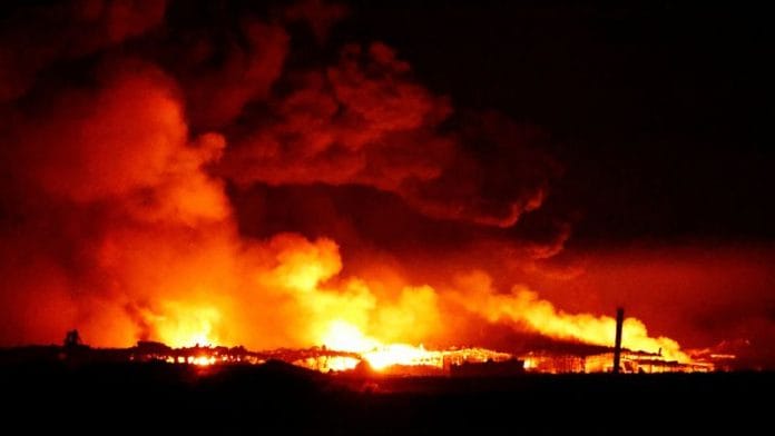 Fire burns in Gaza as seen from southern Israel, on 15 December 2023 | Reuters
