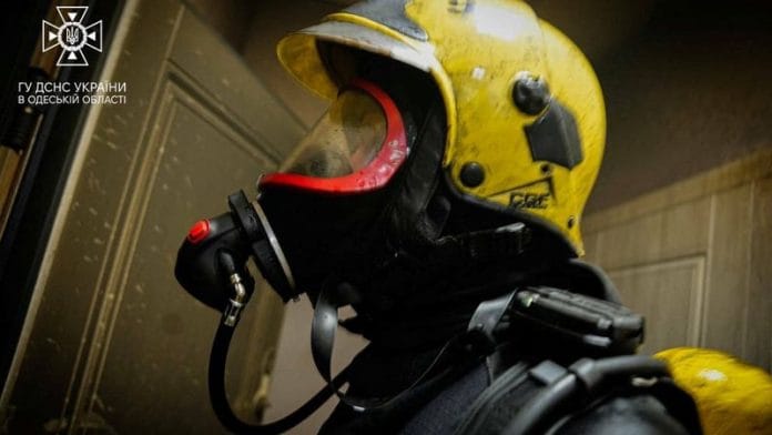 A rescuer works at the site damaged by the debris of a downed drone, amid Russia's attack on Ukraine, in the location given as Odesa, Ukraine, released December 29, 2023. State Emergency Service Of Ukraine/Handout via REUTERS