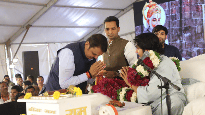 Maharashtra Deputy Chief Minister Devendra Fadnavis greets Dhirendra Krishna Shastri at the latter's event in Pune | Pic credit: X/@bageshwardham