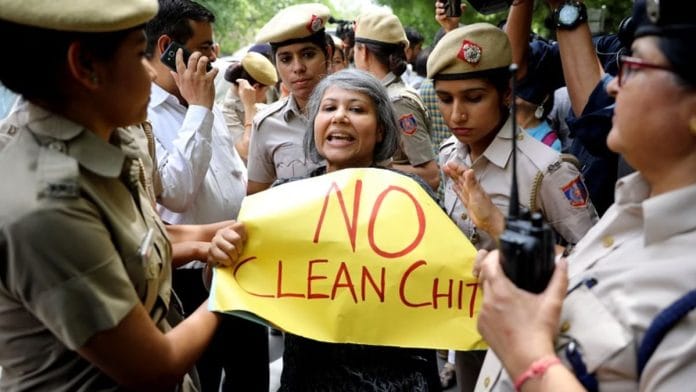 A woman activist protests against the clean chit given to CJI Gogoi outside the Supreme Court | ANI