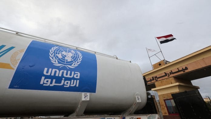 A truck, marked with United Nations Relief and Works Agency (UNRWA) logo, crosses into Egypt from Gaza, at the Rafah border crossing between Egypt and the Gaza Strip, during a temporary truce between Hamas and Israel, in Rafah, Egypt, November 27, 2023 | Reuters