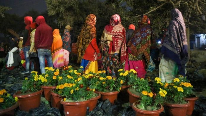 A group of women potting flowers in Ayodhya Saturday | Photo: Suraj Singh Bisht/ThePrint