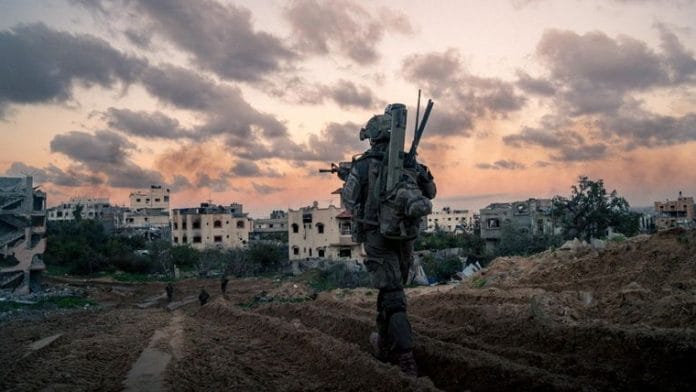 Israeli soldiers operate in the Gaza Strip amid the ongoing conflict between Israel and the Palestinian Islamist group Hamas, in this handout picture released on 16 Jan 2024 | Israel Defense Forces/Handout via Reuters