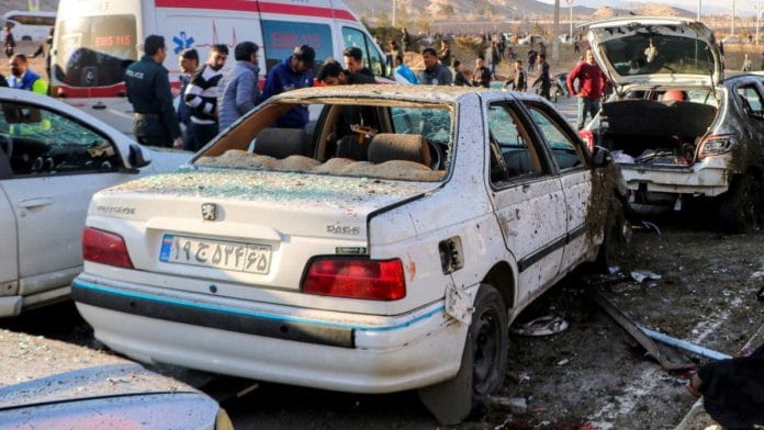 People gather at the scene of explosions during a ceremony held to mark the death of late Iranian General Qassem Soleimani, in Kerman, Iran, January 3, 2024. WANA (West Asia News Agency) via REUTERS
