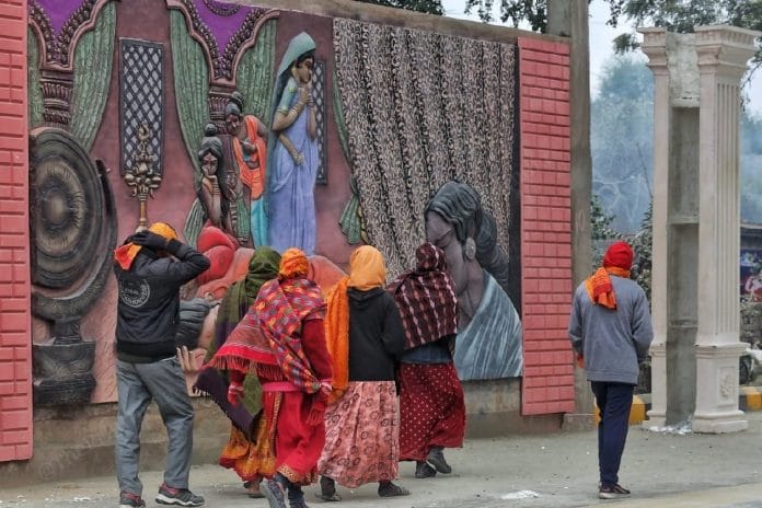 People walk past neat the street art near Lata Mangeshkar Chowk | Praveen Jain | ThePrint