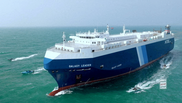 The Galaxy Leader cargo ship is escorted by Houthi boats in the Red Sea in this photo released November 20, 2023. Houthi Military Media | Handout via Reuters