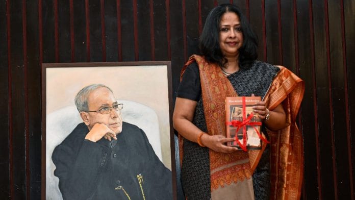 Sharmistha Mukherjee with the first copy of her book 'Pranab, My Father: A Daughter Remembers' in New Delhi | ANI/Jitender Gupta