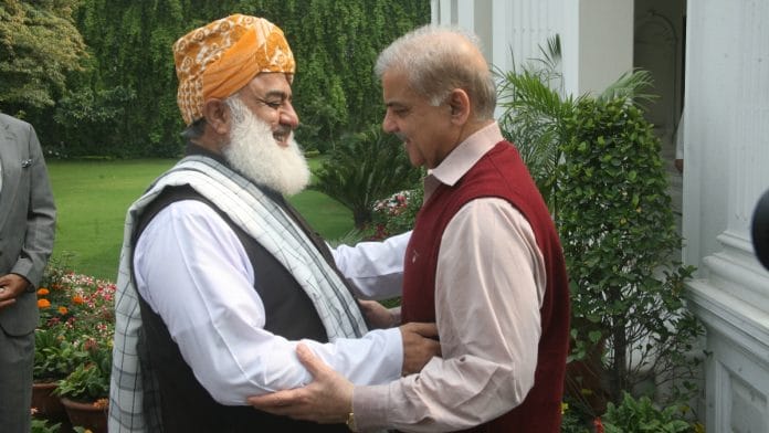 CM Shehbaz with Fazl-ur-Rehman } Commons