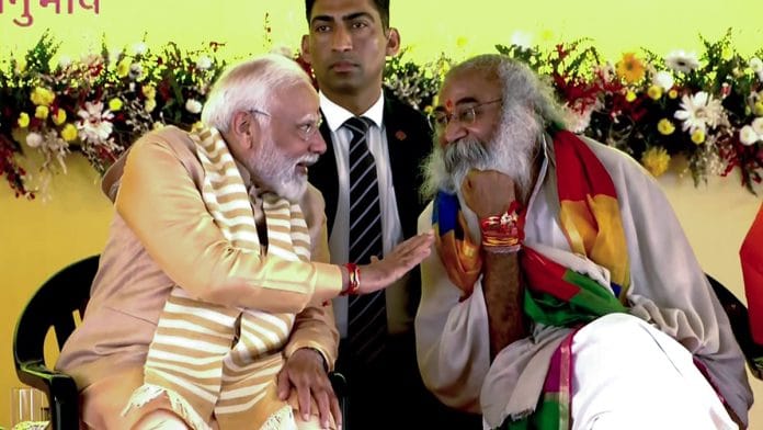 PM Narendra Modi with Acharya Pramod Krishnam in Sambhal, Monday | ANI