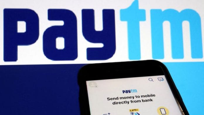 The interface of Indian payments app Paytm is seen in front of its logo displayed in this illustration picture taken July 7, 2021. REUTERS/Florence Lo/Illustration/File Photo