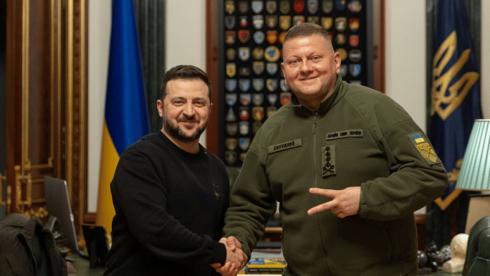Ukraine's President Ukraine's President Volodymyr Zelenskyy and Commander-in-Chief of the Ukrainian Armed Forces Valerii Zaluzhnyi shake hand and pose for a picture during their meeting, amid Russia's attack on Ukraine, in Kyiv, Ukraine | Handout via Reuters
