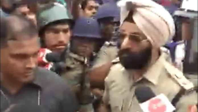 A screen grab of the IPs officer Jaspreet Singh arguing with BJP members | Source: @MamataOfficial