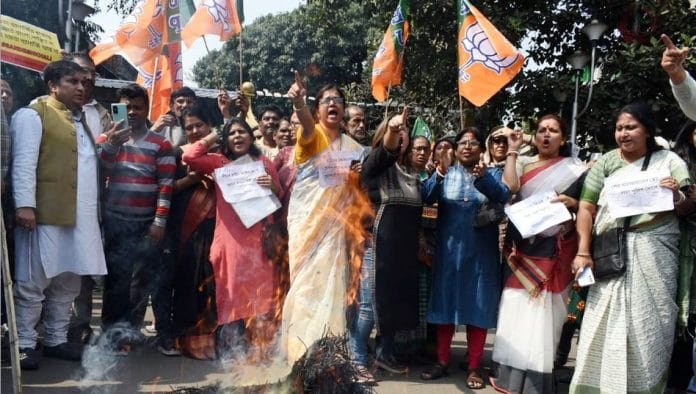 BJP supporters burn effigies, raise slogans during a protest against the Sandeshkhali violence, in Kolkata on 11 February | ANI Photo